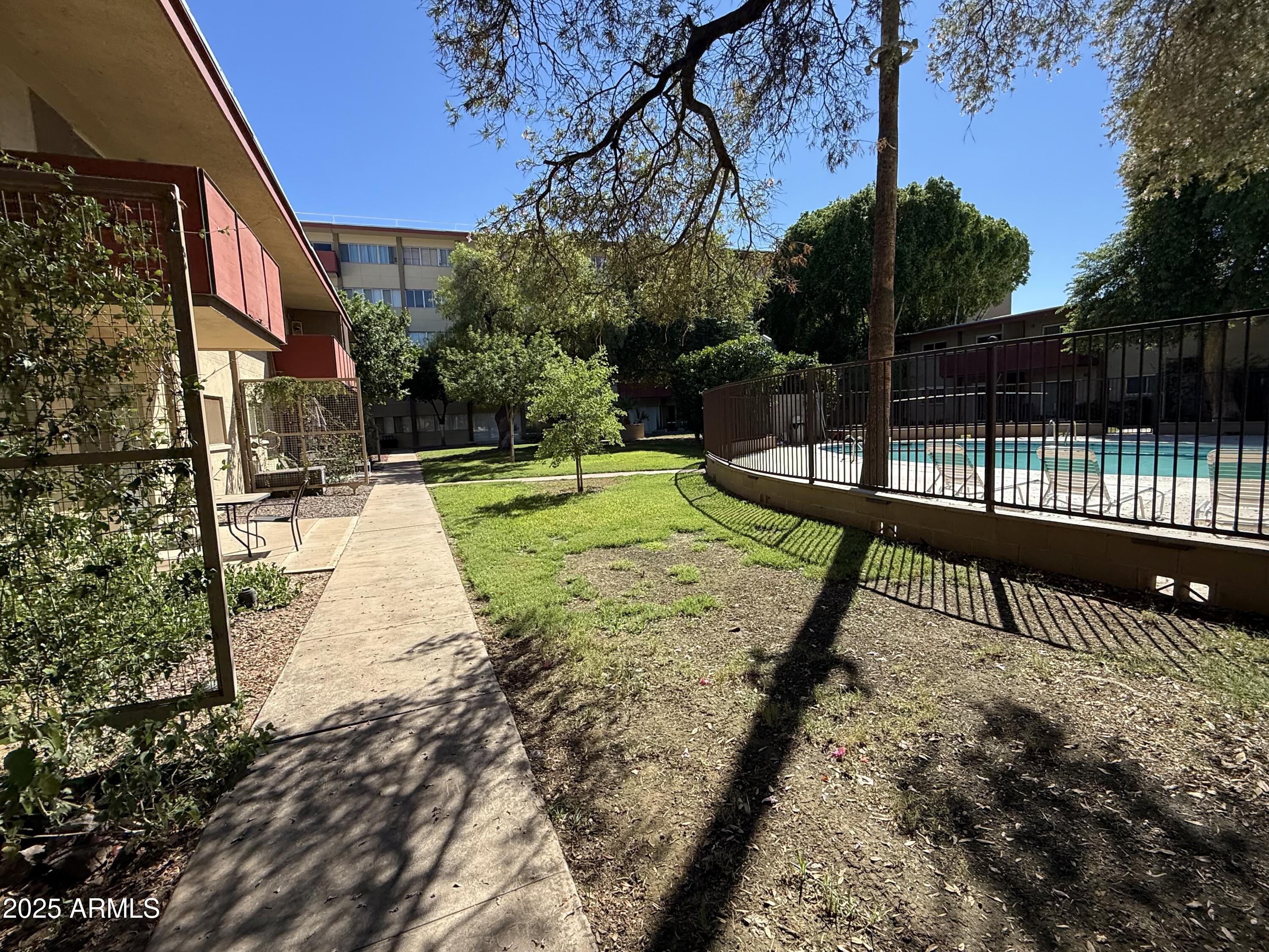 357 East Thomas Road, Unit A105 Phoenix, AZ 85012 - Photo 44 of 51 a view of a park with swings and slides