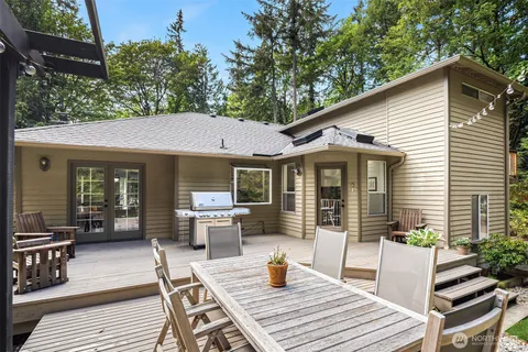 a view of a table and chairs in patio of the house