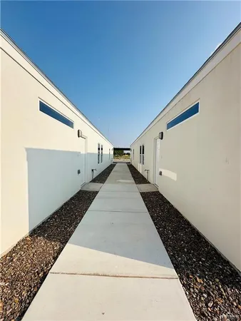 a view of a back yard with wooden floor
