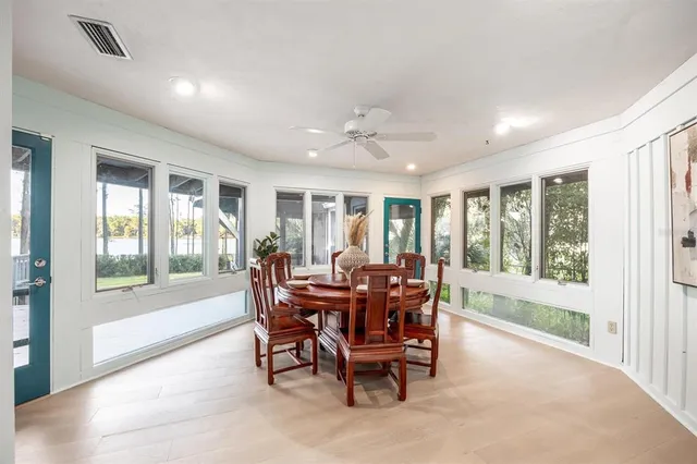a view of a dining room with furniture window and outside view