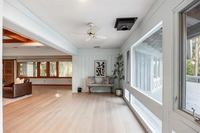 a bed room with a bed and a large window