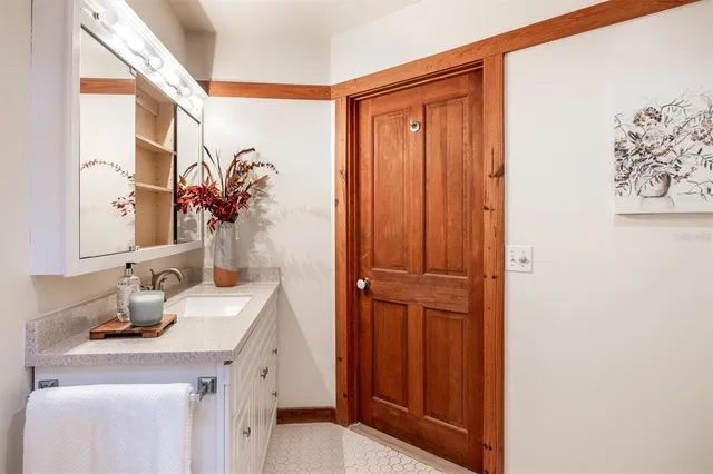 a bed room with a bed and a large window