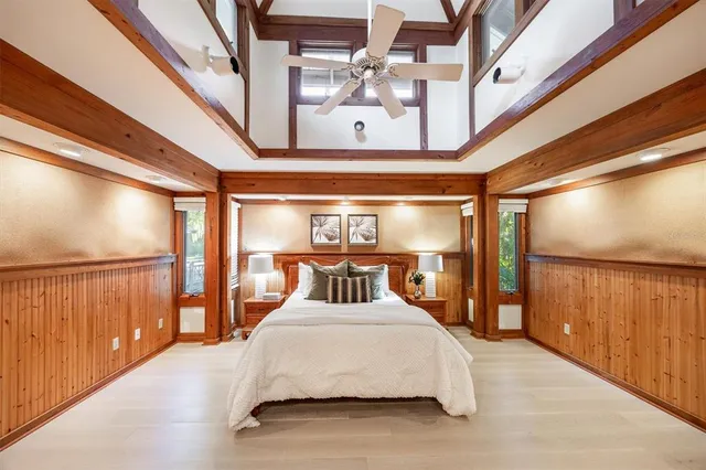 a bedroom with a bed and a window