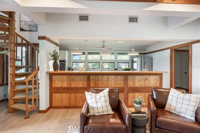 a spacious bedroom with a bed and a large window