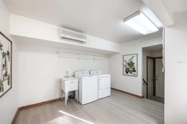a view of a house with a patio and wooden deck