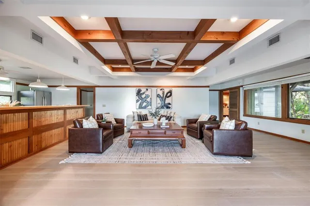 a kitchen with stainless steel appliances granite countertop a refrigerator and a stove