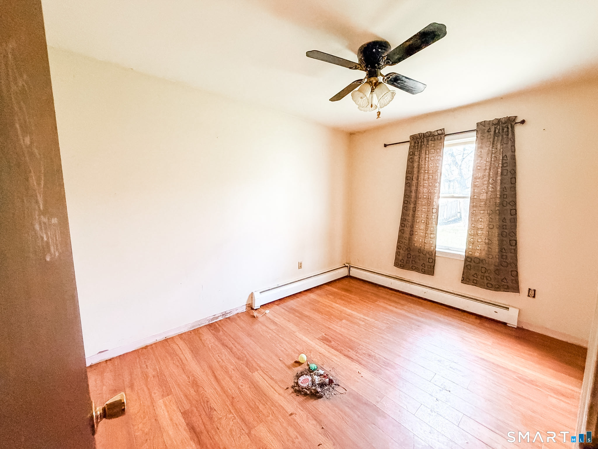 21 Potvin Avenue Plainfield, CT 06354 - Photo 11 of 17 wooden floor in an empty room with a window