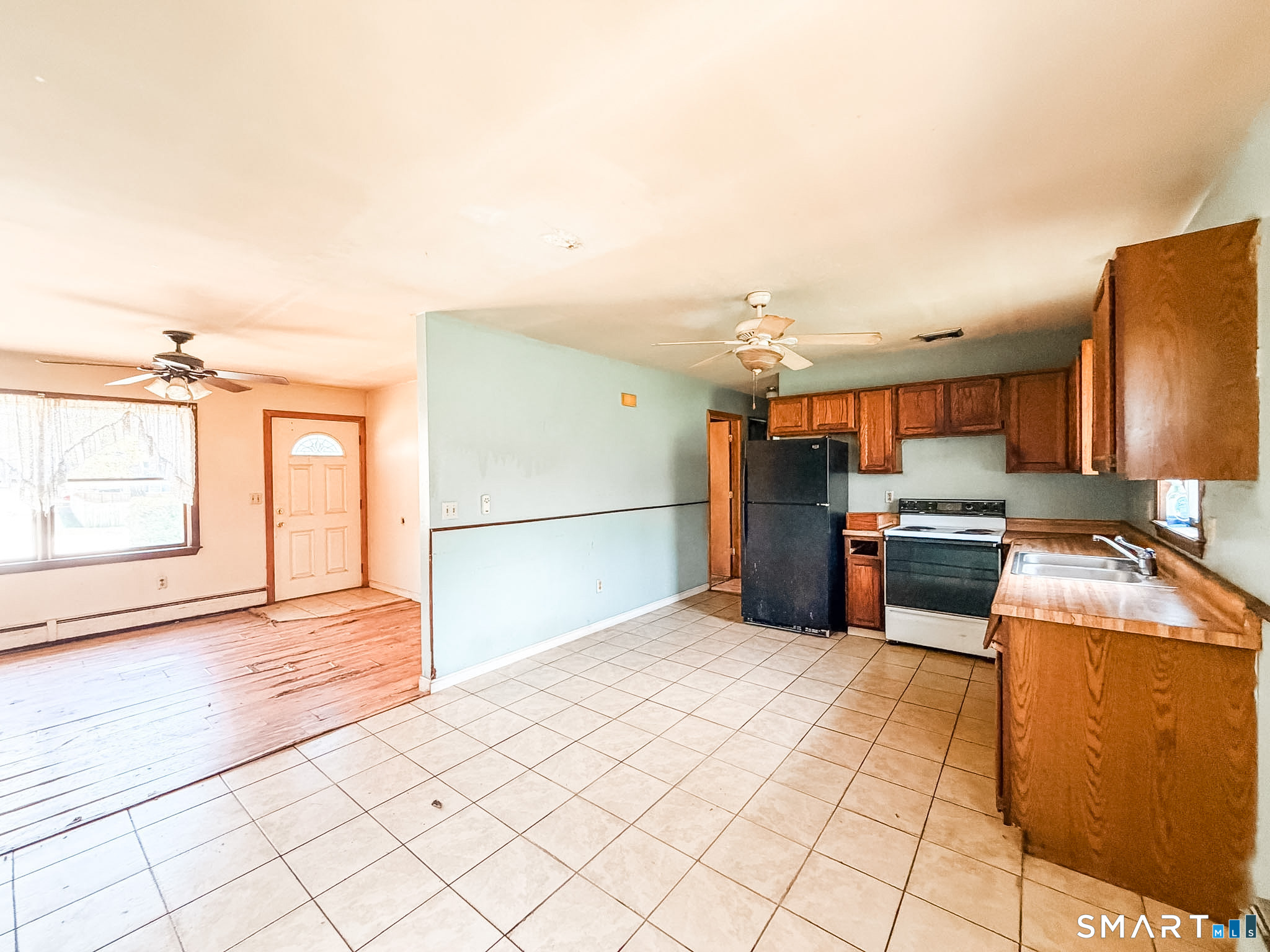 21 Potvin Avenue Plainfield, CT 06354 - Photo 7 of 17 a kitchen with stainless steel appliances kitchen island granite countertop a refrigerator and a stove top oven
