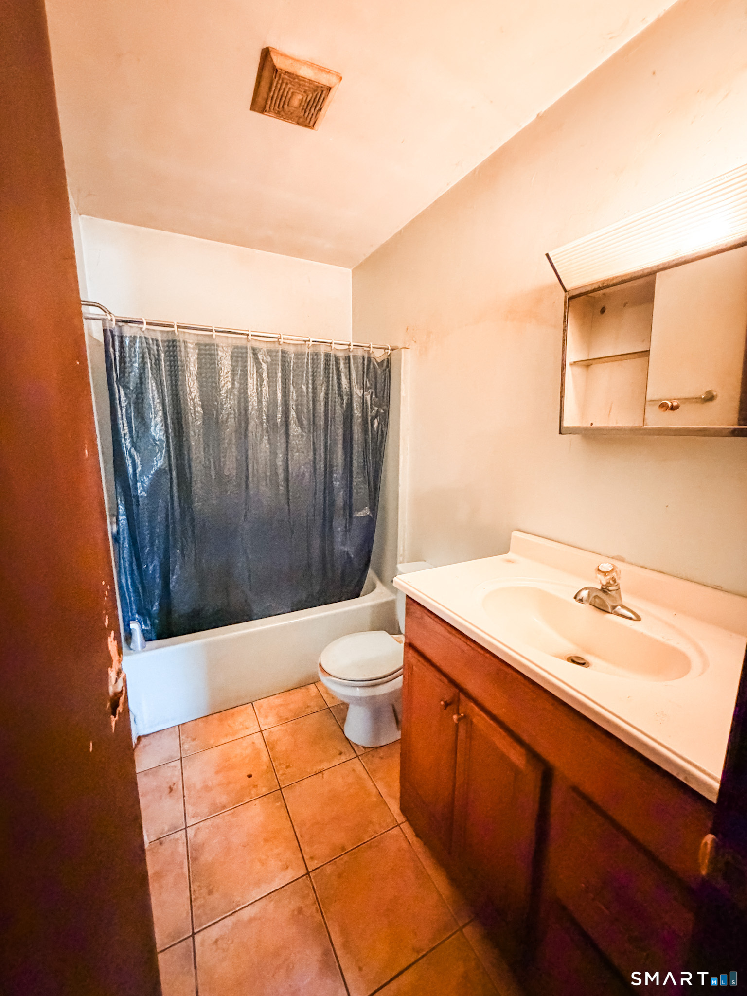 21 Potvin Avenue Plainfield, CT 06354 - Photo 8 of 17 a bathroom with a sink a toilet and shower