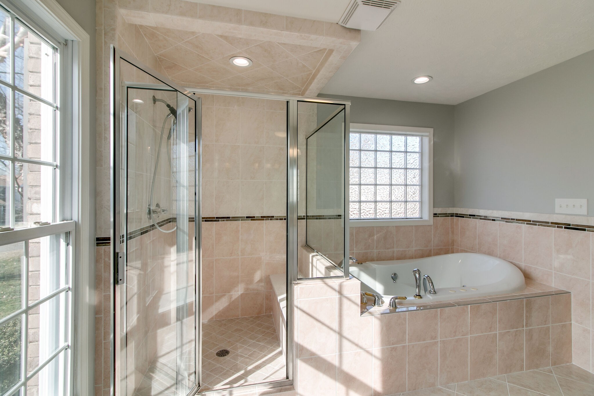 3595 Rabbit Run Trail Clarksville, TN 37043 - Photo 14 of 30 a bathroom with a tub shower and windows