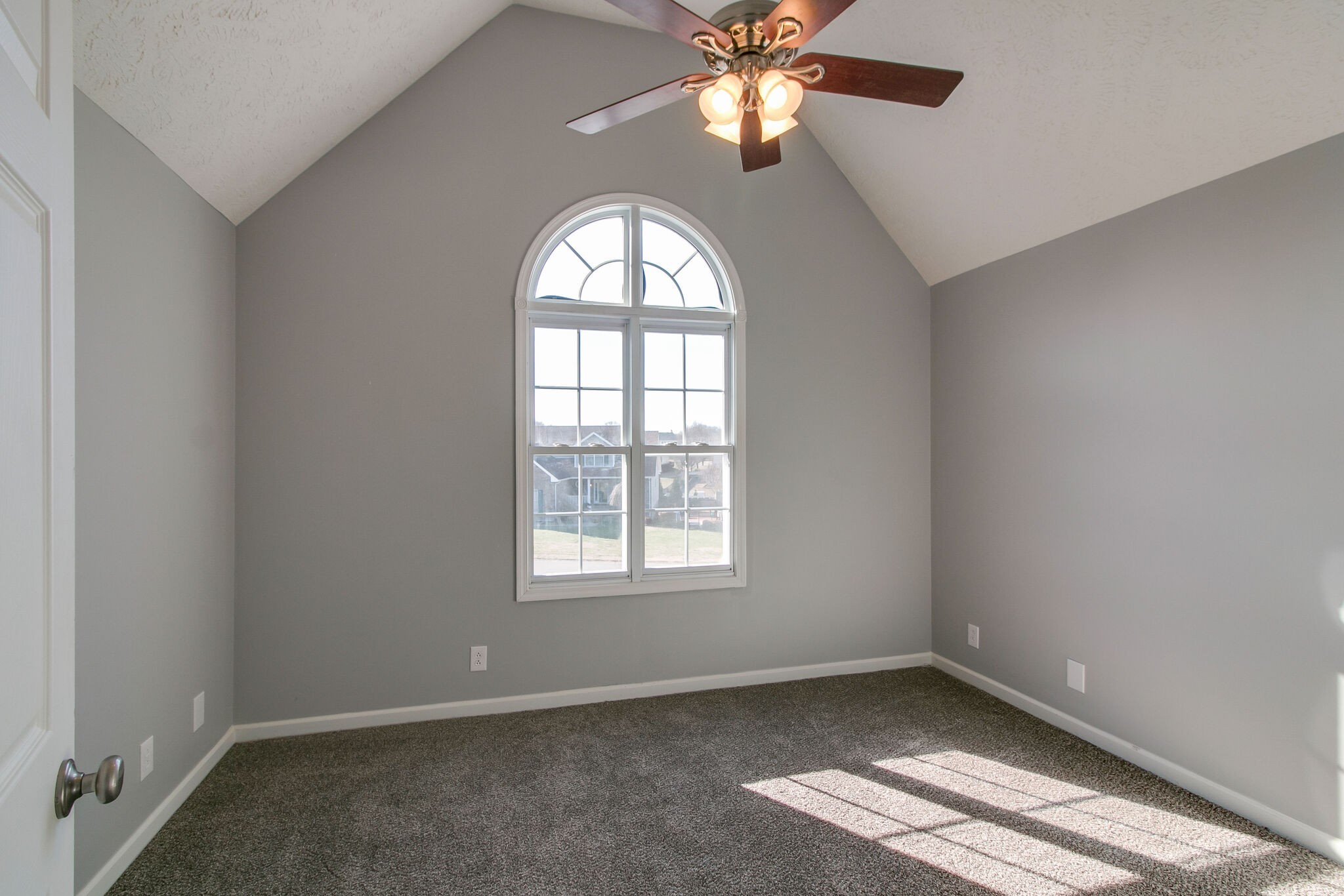 3595 Rabbit Run Trail Clarksville, TN 37043 - Photo 17 of 30 an empty room with a window and a chandelier fan