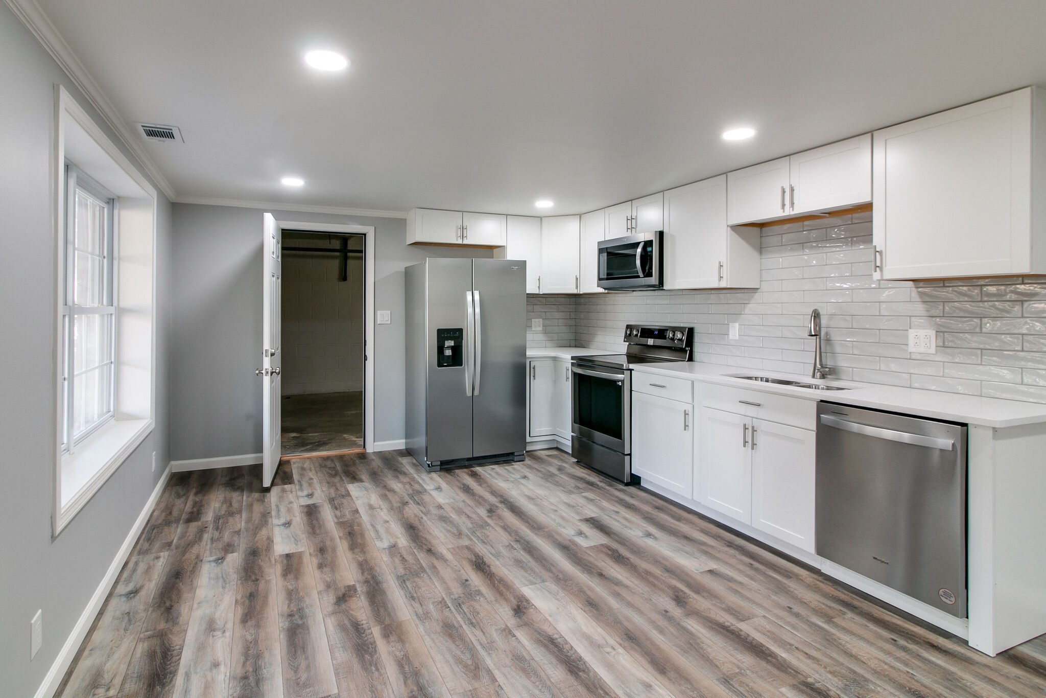 3595 Rabbit Run Trail Clarksville, TN 37043 - Photo 23 of 30 a kitchen with refrigerator cabinets and a sink