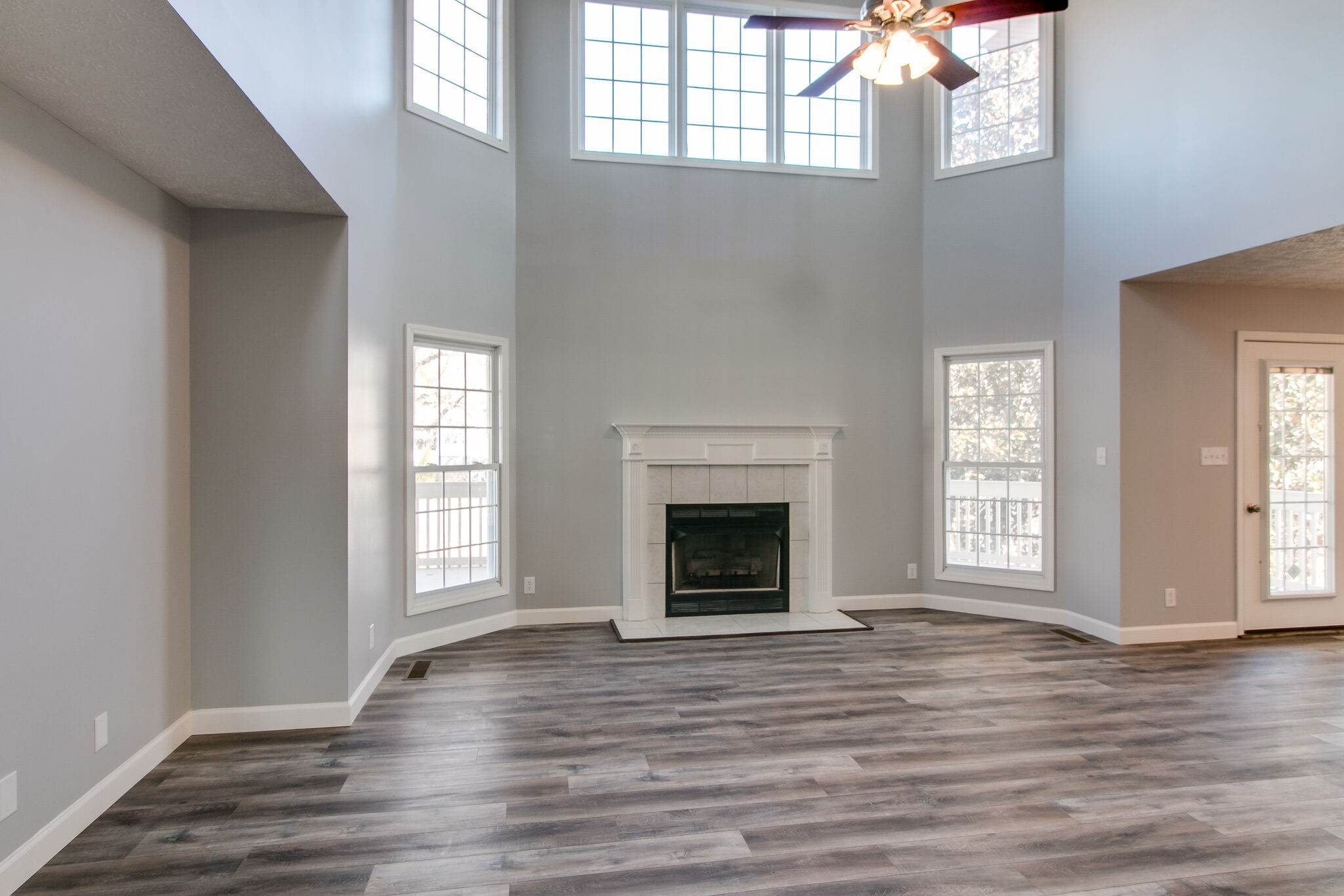 3595 Rabbit Run Trail Clarksville, TN 37043 - Photo 4 of 30 wooden floor fireplace and windows in an empty room