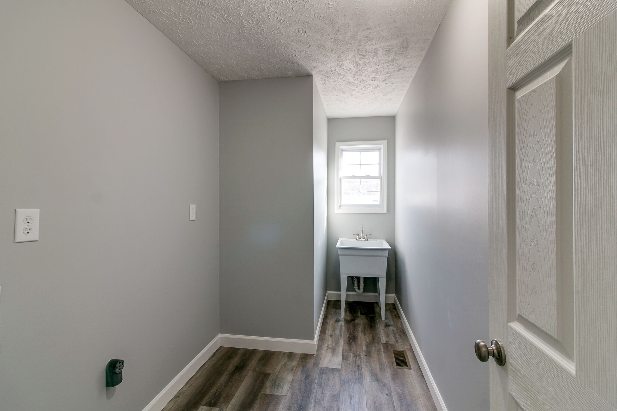 3595 Rabbit Run Trail Clarksville, TN 37043 - Photo 10 of 30 a view of a room with wooden floor and a sink