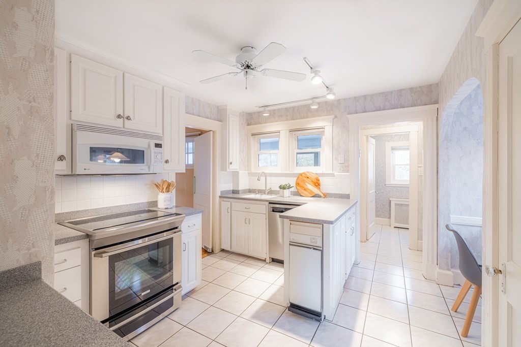 61 Nason Road Swampscott, MA 01907 - Photo 12 of 37 a kitchen with cabinets and stainless steel appliances