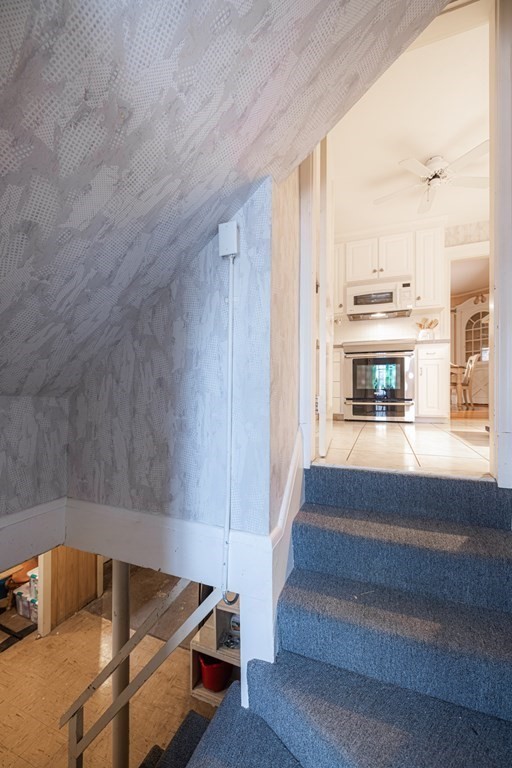 61 Nason Road Swampscott, MA 01907 - Photo 18 of 37 a living room with furniture and a fireplace