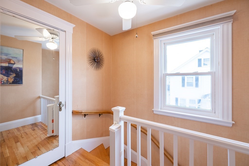 61 Nason Road Swampscott, MA 01907 - Photo 20 of 37 a view of a bedroom with wooden floor and a window