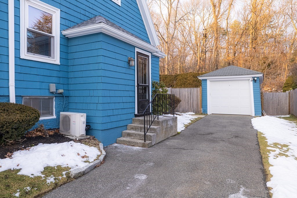 61 Nason Road Swampscott, MA 01907 - Photo 32 of 37 a view of a backyard with table and chairs and wooden fence