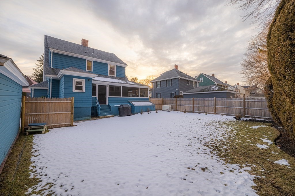 61 Nason Road Swampscott, MA 01907 - Photo 35 of 37 a front view of a house with a yard covered in snow