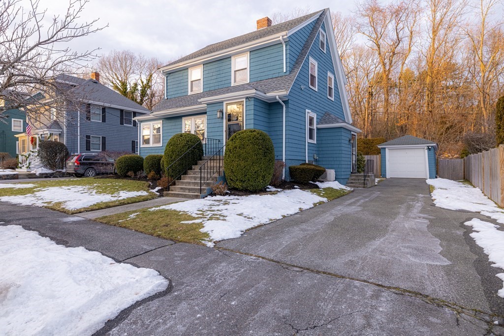 61 Nason Road Swampscott, MA 01907 - Photo 36 of 37 a front view of a house with a yard and garage
