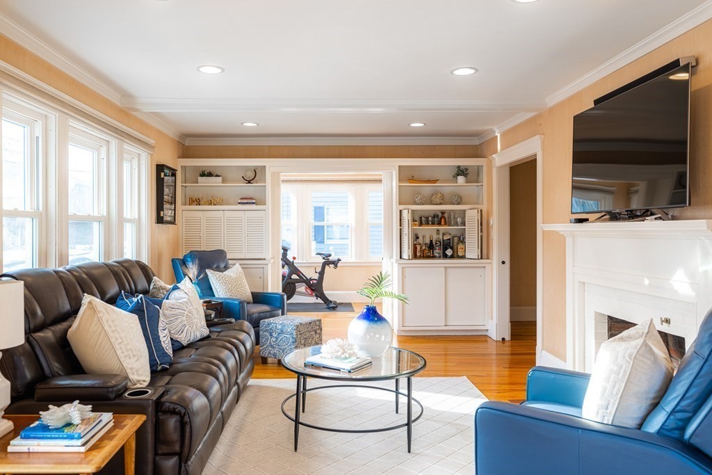 61 Nason Road Swampscott, MA 01907 - Photo 4 of 37 a living room with furniture fireplace and a flat screen tv
