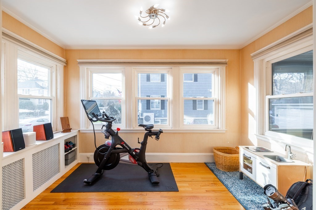 61 Nason Road Swampscott, MA 01907 - Photo 6 of 37 a living room with furniture hard wood floor and a floor to ceiling window