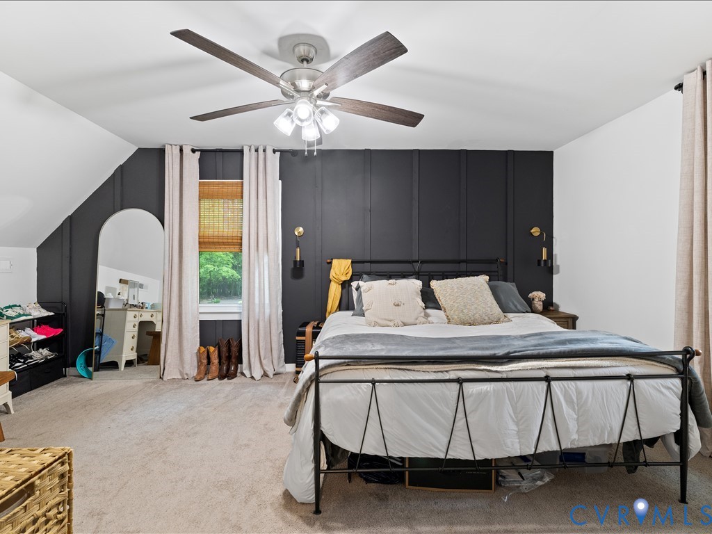 6806 Full Rack Circle Midlothian, VA 23112 - Photo 21 of 29 a bedroom with a bed and a chandelier