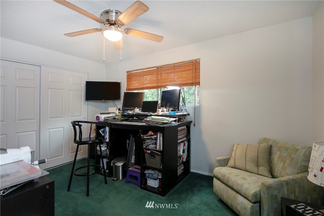 17721 Brook Boulevard Bothell, WA 98012 - Photo 14 of 26 a living room with furniture and a flat screen tv