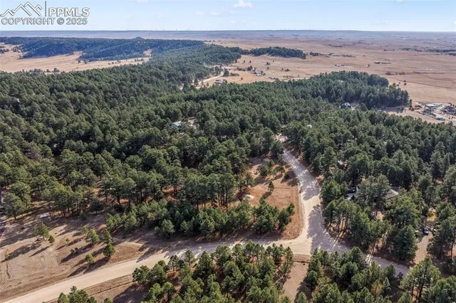 an aerial view of house with yard