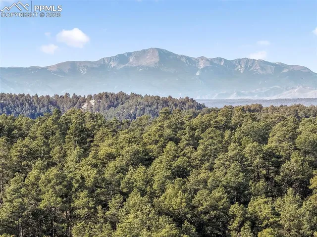 a view of a town with mountains in the background