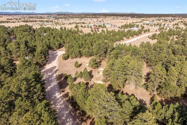 a view of a city with mountains in the background