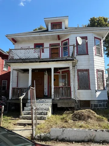 a front view of a house with large windows
