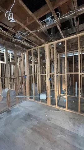 a view of an empty room with wooden walls