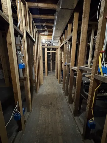 a view of walk in closet with clothes