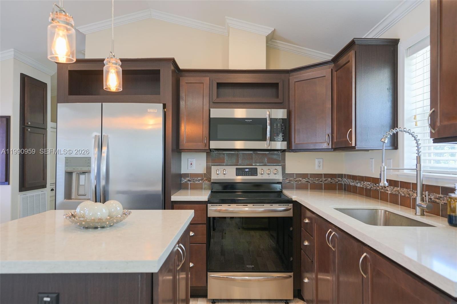 112 Tweedy Pie Terrace Key Largo, FL 33037 - Photo 20 of 39 a kitchen with a sink a stove and refrigerator