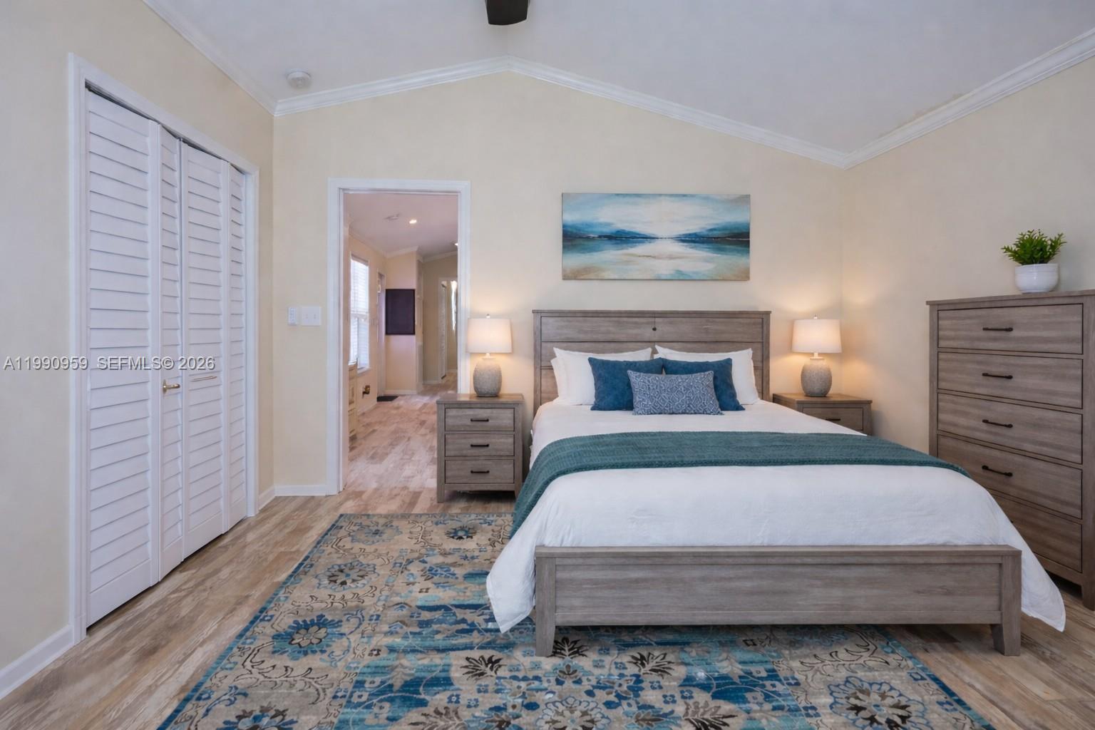 112 Tweedy Pie Terrace Key Largo, FL 33037 - Photo 26 of 39 a bedroom with a bed a rug and wall painting