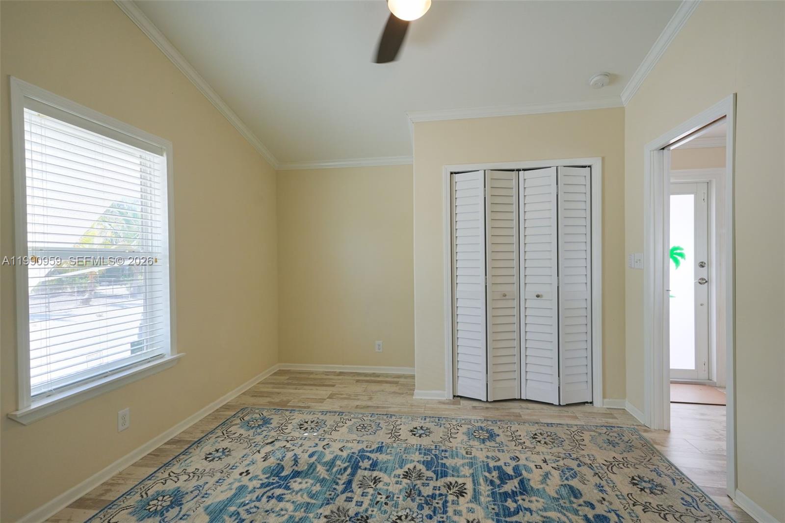 112 Tweedy Pie Terrace Key Largo, FL 33037 - Photo 27 of 39 a view of an empty room with window and wooden floor