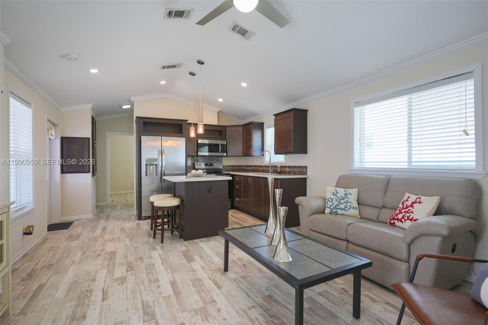 112 Tweedy Pie Terrace Key Largo, FL 33037 - Photo 30 of 39 a living room with stainless steel appliances kitchen island granite countertop furniture and a kitchen view