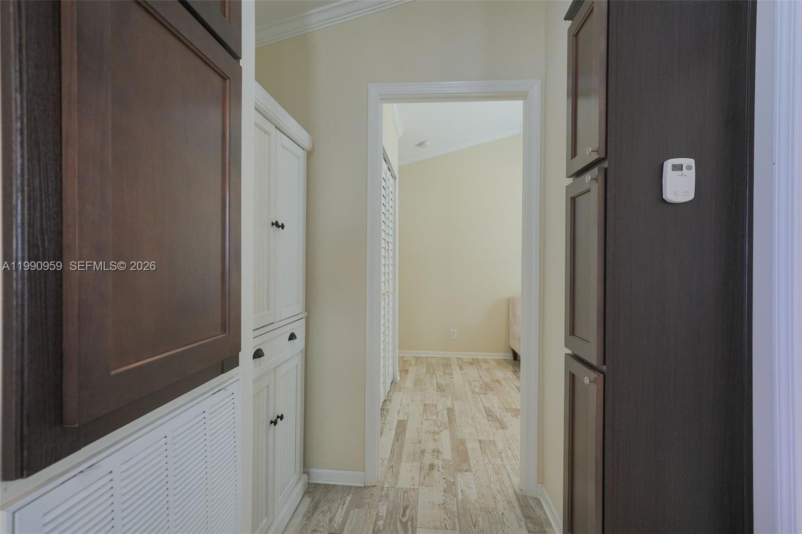 112 Tweedy Pie Terrace Key Largo, FL 33037 - Photo 32 of 39 a view of a hallway with wooden floor