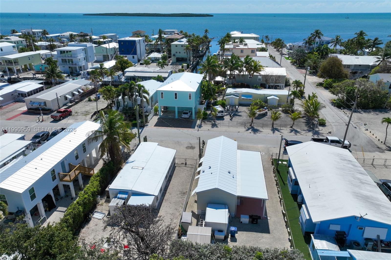 112 Tweedy Pie Terrace Key Largo, FL 33037 - Photo 38 of 39 an aerial view of a house with a yard and outdoor seating
