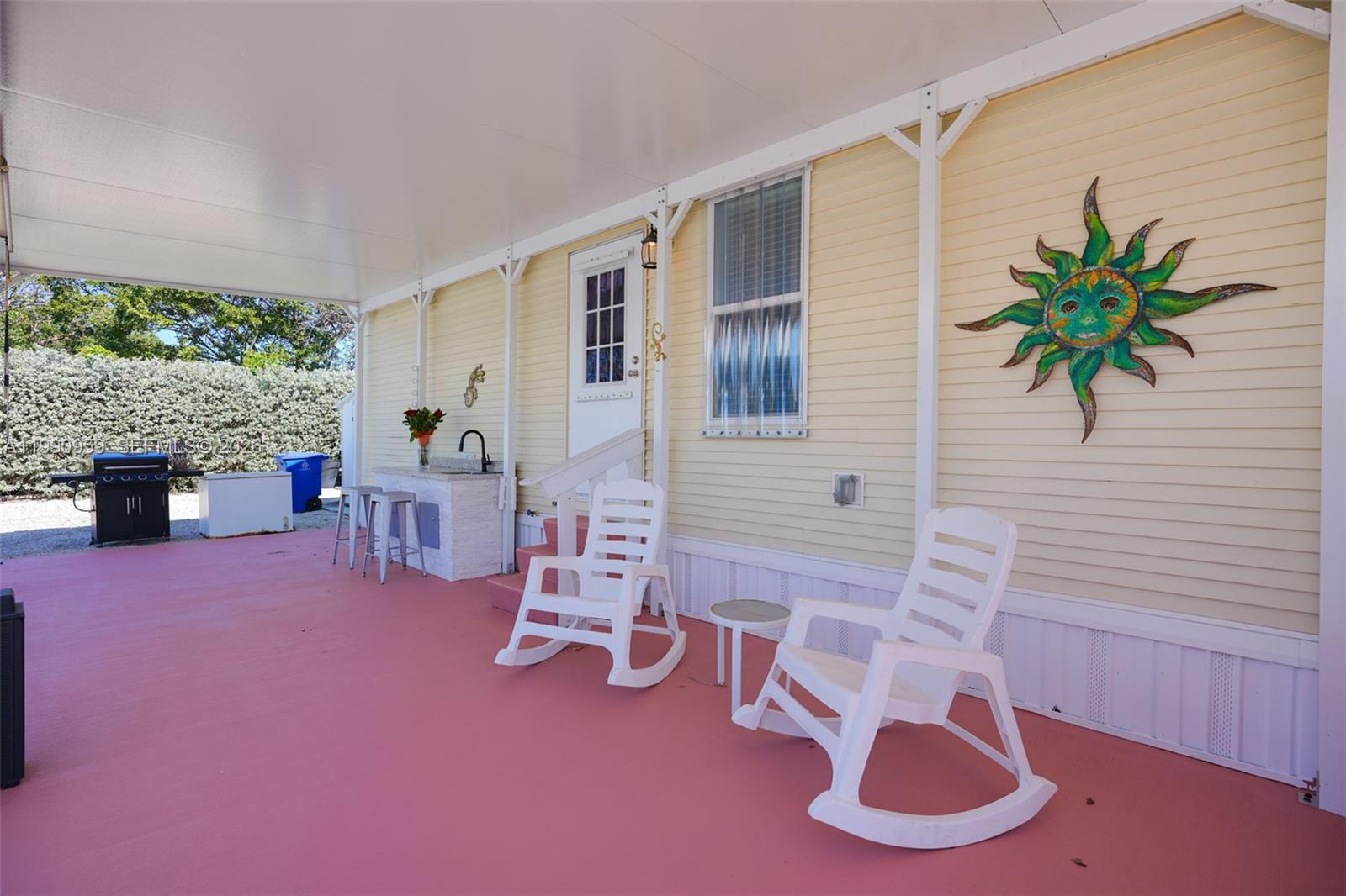 112 Tweedy Pie Terrace Key Largo, FL 33037 - Photo 7 of 39 a living room with furniture and a fireplace