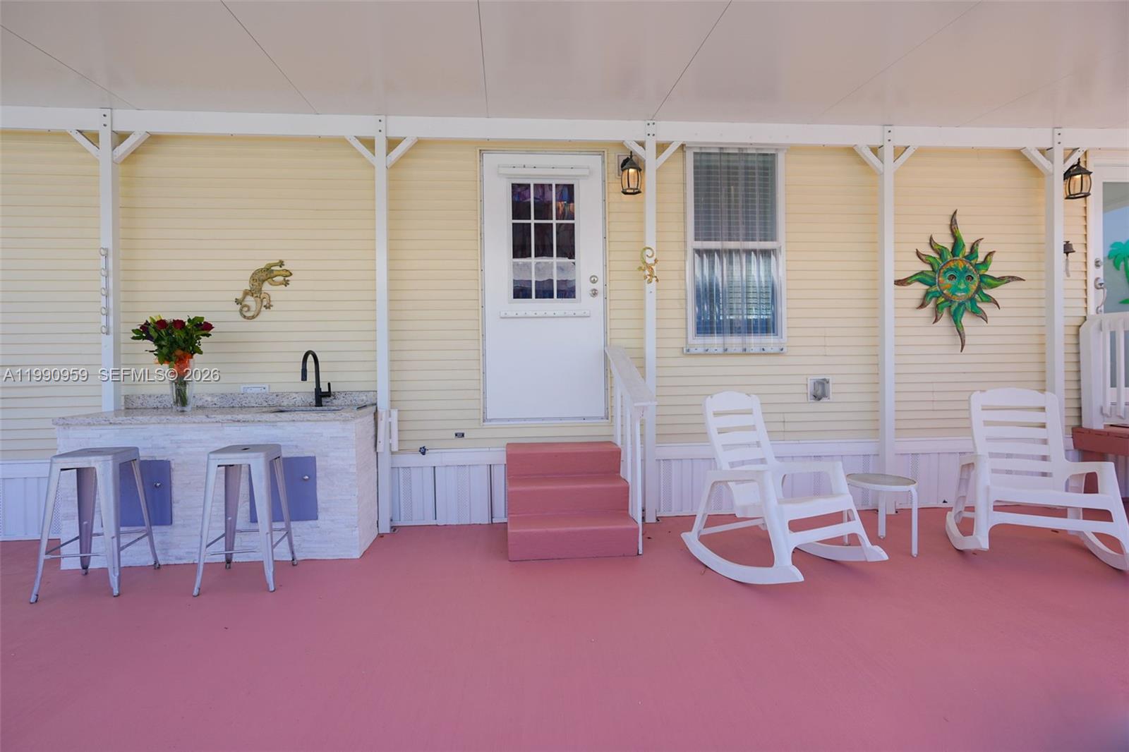 112 Tweedy Pie Terrace Key Largo, FL 33037 - Photo 8 of 39 a bedroom with furniture and a potted plant