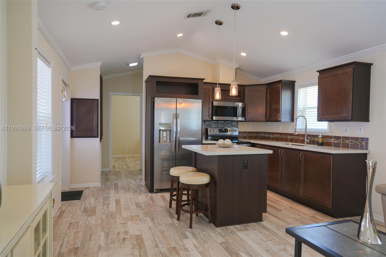 112 Tweedy Pie Terrace Key Largo, FL 33037 - Photo 9 of 39 a kitchen with refrigerator and sink