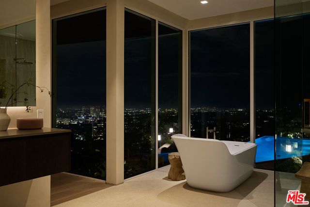 a view of a living room and patio