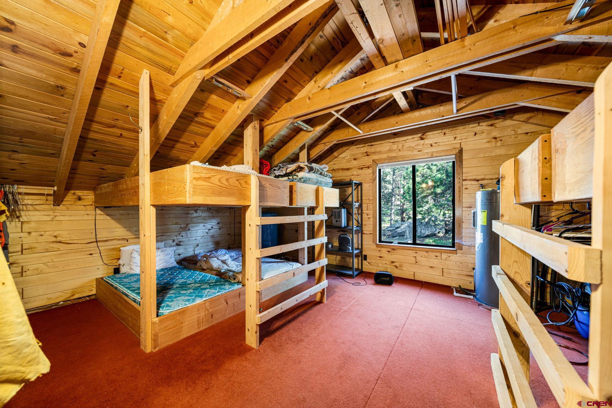 1875 Silver Mesa Driveway Durango, CO 81301 - Photo 22 of 27 a view of an empty room with a fireplace