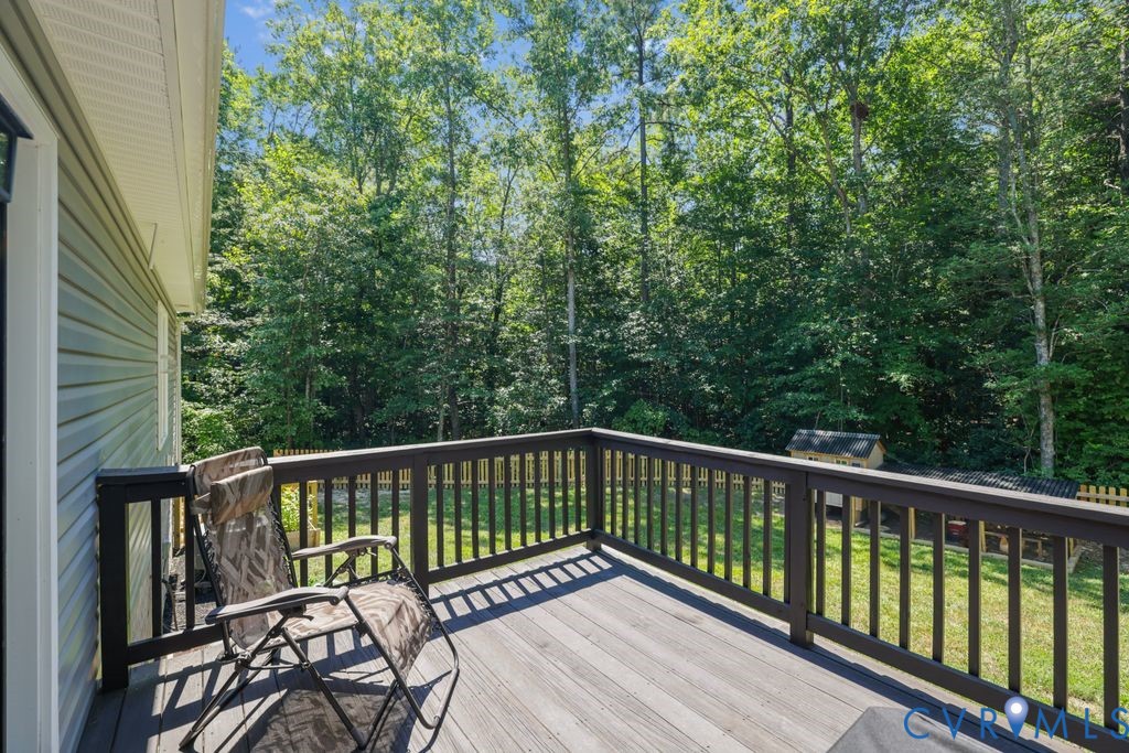 222 Oak Ridge Court Aylett, VA 23009 - Photo 28 of 35 Spacious exterior deck with dark wood-finish raili