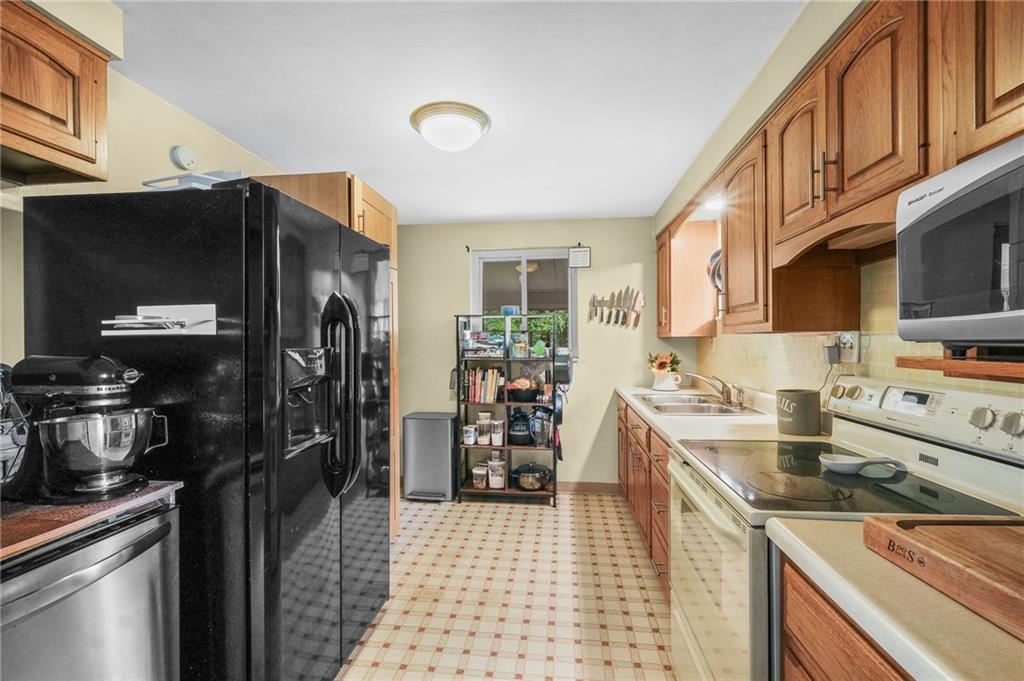 1654 Hollyrood Road Pittsburgh, PA 15227 - Photo 20 of 33 a kitchen with a sink and cabinets