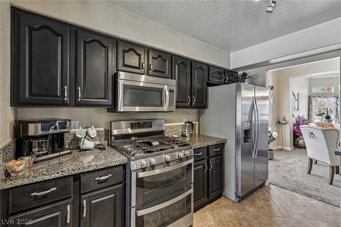 5236 Saranac Road Las Vegas, NV 89130 - Photo 20 of 52 All stainless appliances including refrigerator stay with property