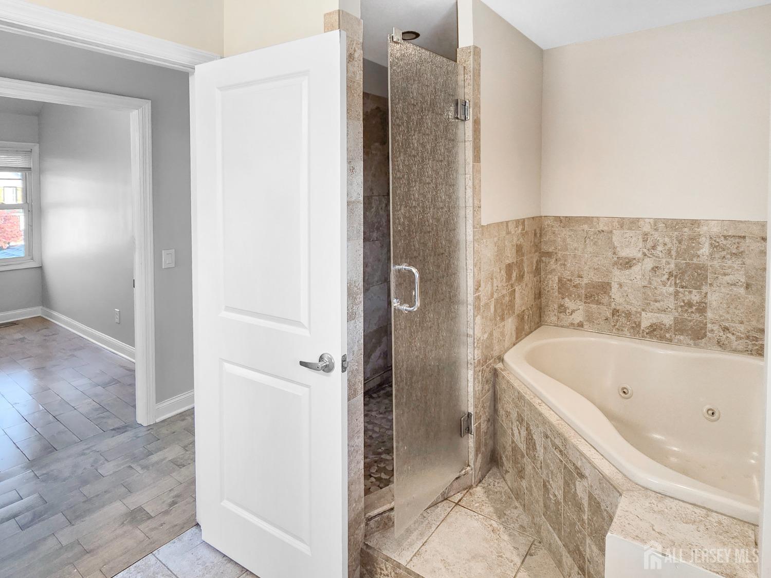 338 Runyon Avenue Middlesex, NJ 08846 - Photo 12 of 27 a bathroom with a bathtub and a shower