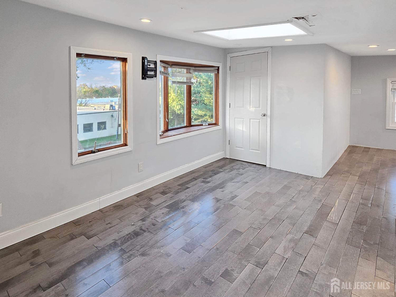 338 Runyon Avenue Middlesex, NJ 08846 - Photo 13 of 27 a view of an empty room with wooden floor and a window